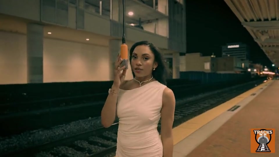 Kierra Sari at the microphone — still from I Get Lonely live