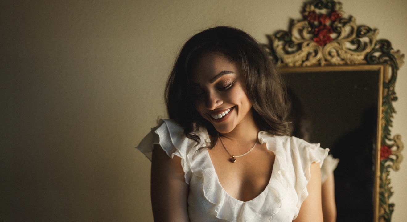 Kierra Sari smiling in warm light
